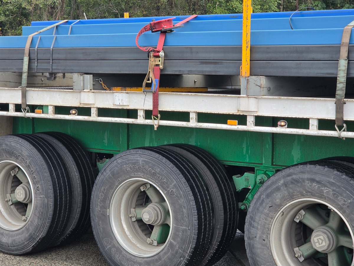 Race Reels load restraint system in use on a steel delivery truck
